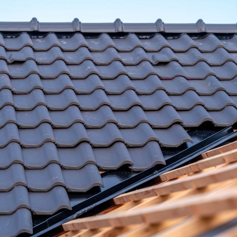 construction of the roof of a family house, wooden beams and ceramic bags